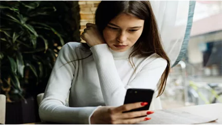 woman texting on her cellphone