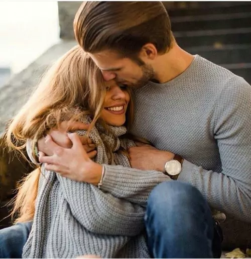 couple-smiling-and-embracing couple hugging eachother